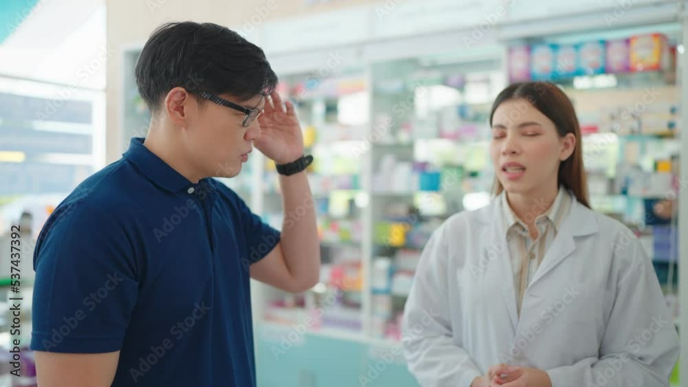 A customer consult a headache with a pharmacist in a pharmacy. and buy medicine about his symptoms A customer consult a headache with a pharmacist in a pharmacy. and buy medicine about his symptoms