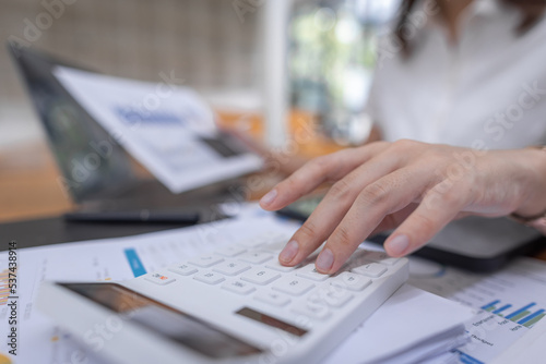 Businessman working at office with documents on his desk, doing planning analyzing the financial report, business plan investment, finance analysis concept 