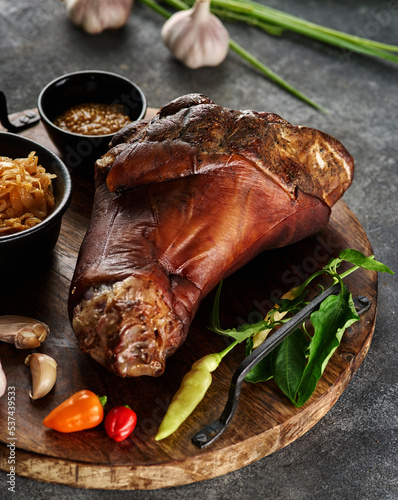Canvas Print Smoked pork knuckle with stewed cabbage and spices