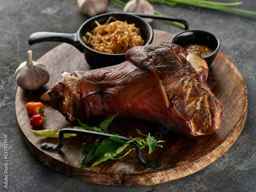 Canvas Print Smoked pork knuckle with stewed cabbage and spices