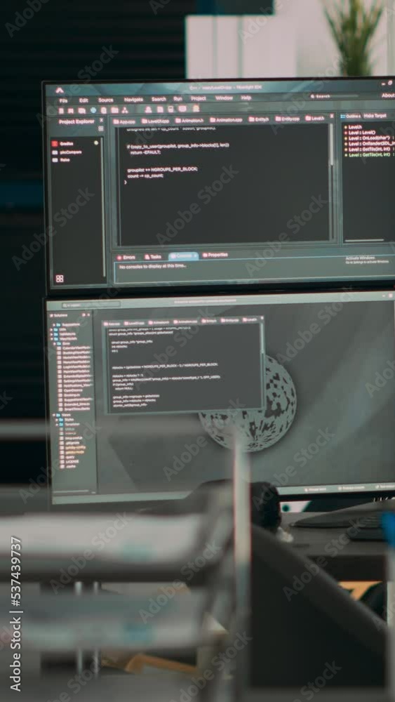 Video Stock Vertical video: Multiple screens showing programming code ...