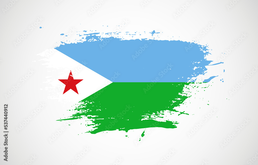 Fototapeta premium Grunge brush stroke with the national flag of Djibouti on a white isolated background