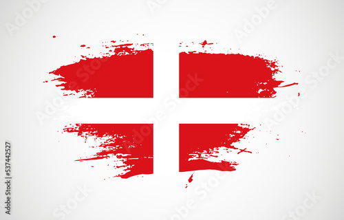 Grunge brush stroke with the national flag of Sovereign Military Order of Malta on a white isolated background