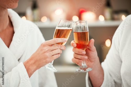 Couple, champagne toast or luxury spa date in marriage success, birthday celebration or holiday travel. Zoom, hands or love man or woman with wine alcohol in relax salon or wellness honeymoon bonding