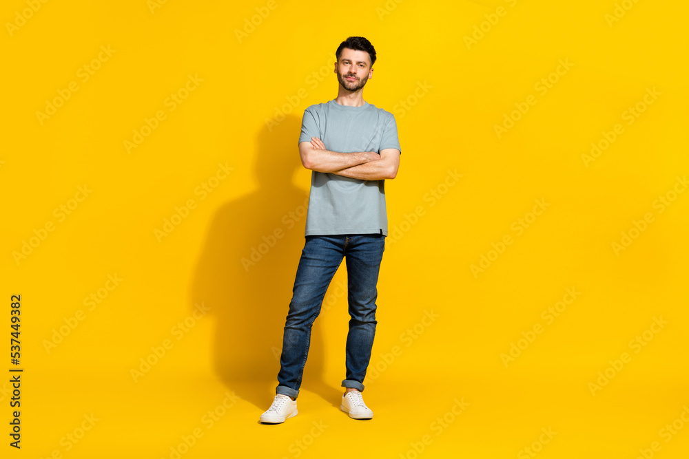 Full length photo of good looking serious man employer company owner dressed stylish outfit arm folded isolated on yellow color background