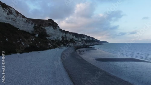 Drone flying fast over a beach at dawn. High quality 4k footage