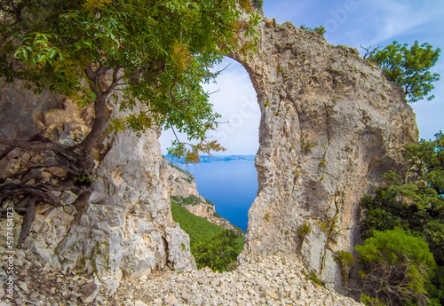 Cala Mariolu in Sardegna, Italy (Italy) - The famous touristic attraction in wild east coast of Sardinia island, Orosei gulf in the Baunei municipal, with wonderful beach, sea and trekking path. photo