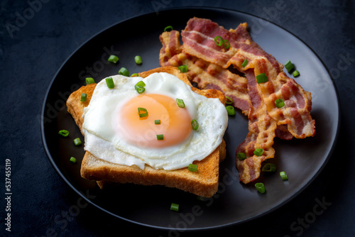 Fried eggs with bacon. Baco...