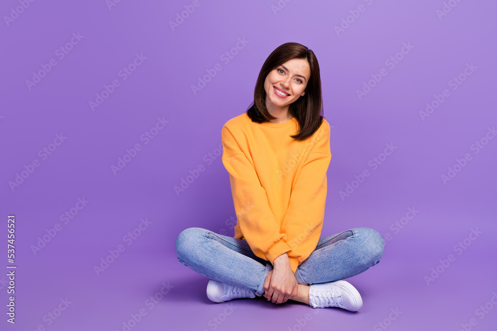 Full length photo of nice good looking lady sit floor rest relax holiday weekend pastime enjoy isolated on purple color background Full length photo of nice good looking lady sit floor rest relax holiday weekend pastime enjoy isolated on purple color background