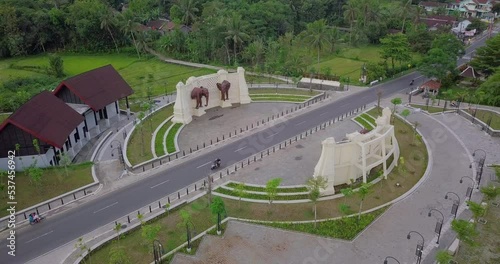 Drones shot of KEMBANG LIMUS GATE As access to Borobudur temple when traffic conditions are few vehicles passing - Magelang, Indonesia photo