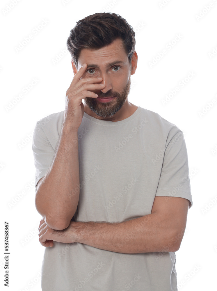 Embarrassed man covering face with hand on white background Embarrassed man covering face with hand on white background