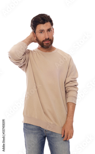 Embarrassed man in pullover on white background