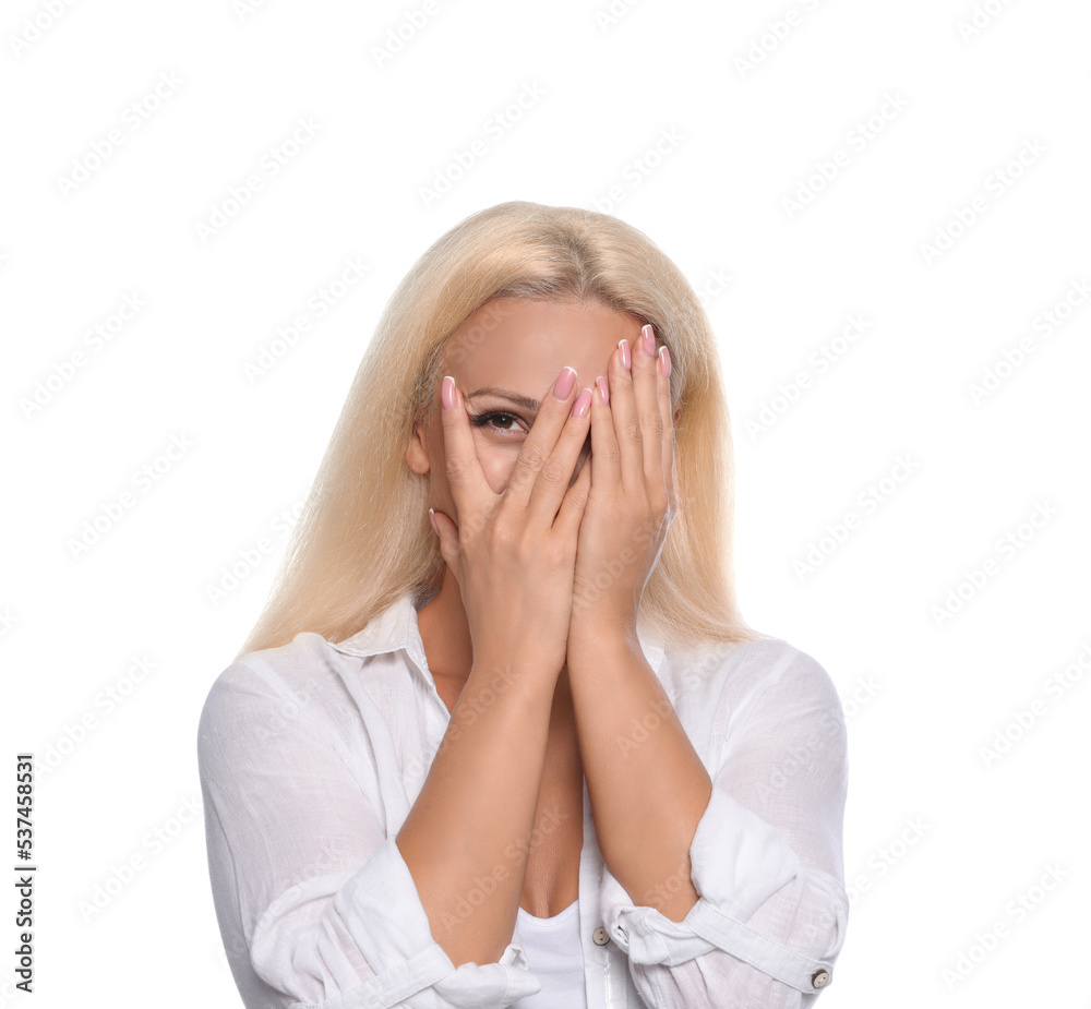 Embarrassed woman covering face with hands on white background Embarrassed woman covering face with hands on white background