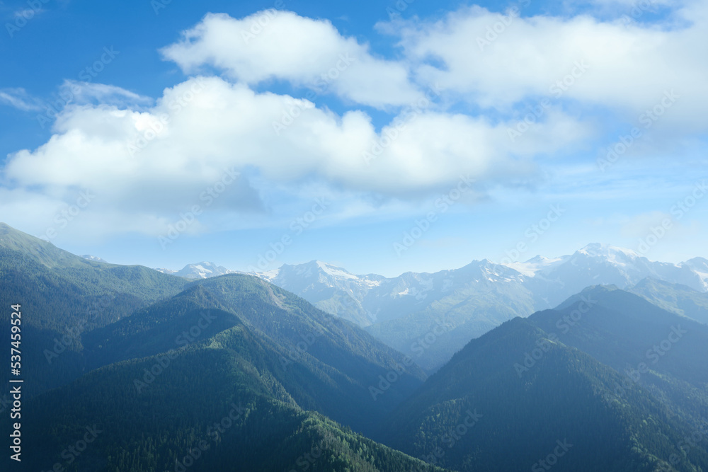 Aerial view of beautiful landscape with mountain forest on sunny day