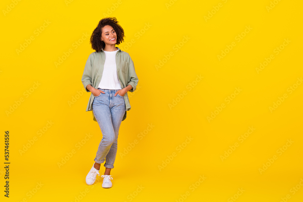 Full size photo of positive lady looking away empty space garment boutique bargains isolated vivid color background Full size photo of positive lady looking away empty space garment boutique bargains isolated vivid color background
