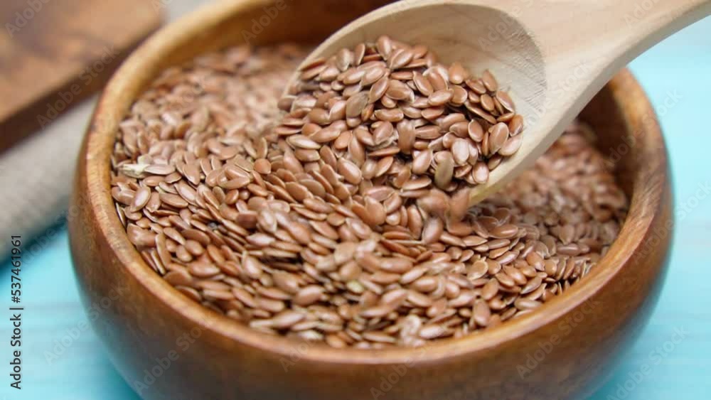 Getting oil from flax seeds. Linseed oil is made from flax seeds. Selective focus. Slow motion Getting oil from flax seeds. Linseed oil is made from flax seeds. Selective focus. Slow motion