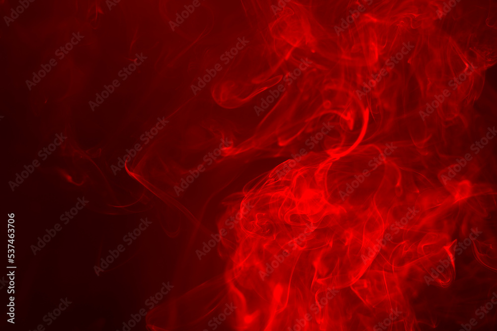 Fototapeta premium Red smoke on a black background