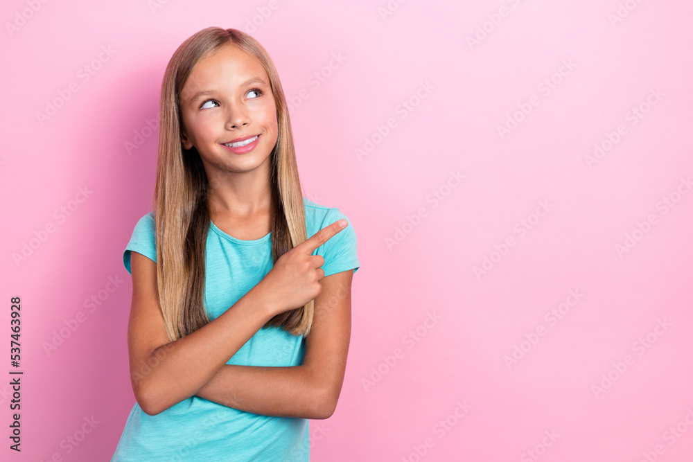 Closeup photo of nice pretty charming preteen lady wear cyan t-shirt finger pointing looking dreamy new clothes sale isolated on pink color background