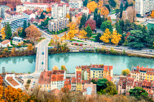 Fototapeta Naklejka Na Ścianę i Meble -  Grenoble France 11/2021 photo tiltshift vue de Grenoble depuis les hauteurs de la bastille, célèbre pour son téléphérique appelé les bulles de Grenoble.