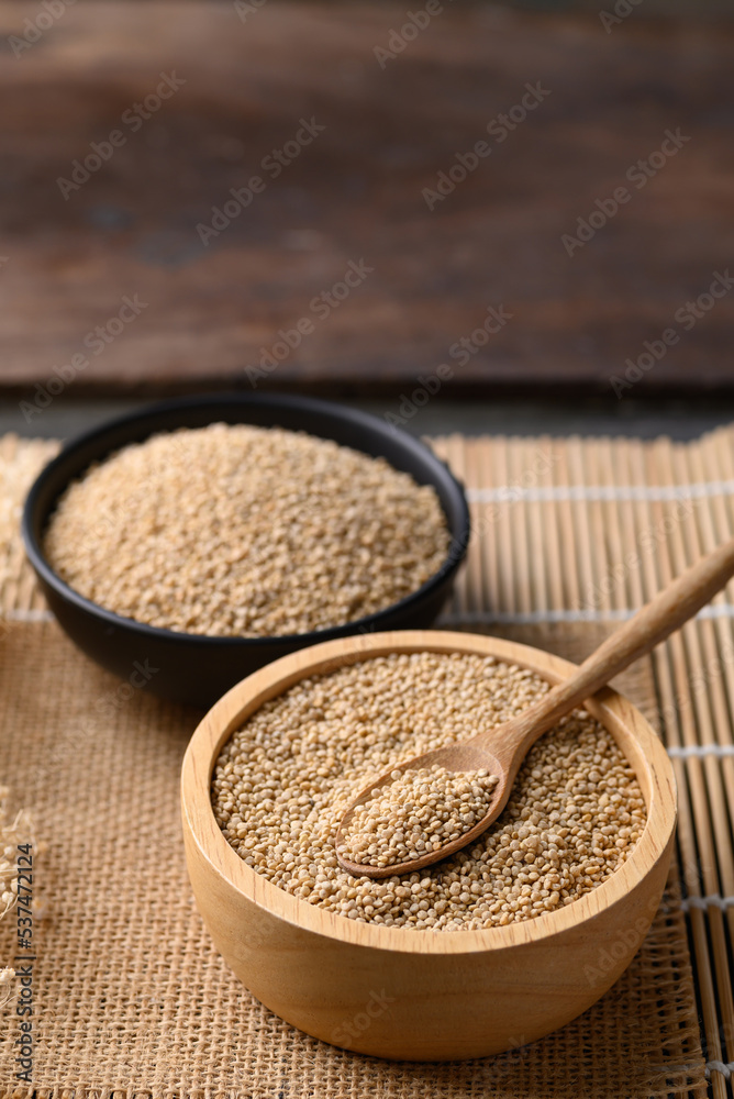 Brown quinoa seed in wooden bowl with spoon, Super food Brown quinoa seed in wooden bowl with spoon, Super food