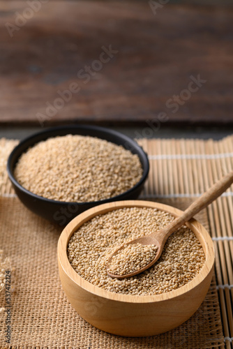 Brown quinoa seed in wooden bowl with spoon, Super food