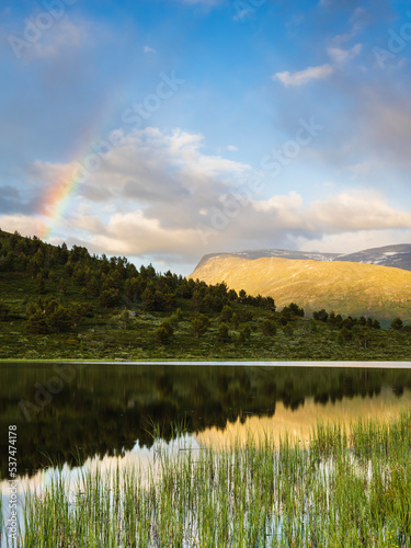 View of rainbow over lake photo