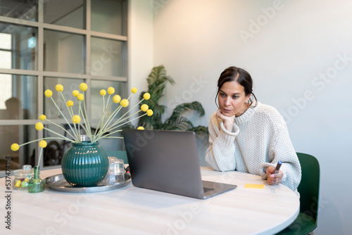 Woman working from home photo