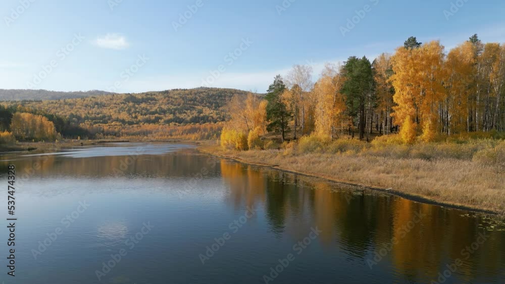 Beautiful autumn lake and forest. Walk in the forest with autumn trees. Yellow leaves. Canadian maple. Nature in autumn. Reflection of autumn trees in the water. Beautiful autumn lake and forest. Walk in the forest with autumn trees. Yellow leaves. Canadian maple. Nature in autumn. Reflection of autumn trees in the water.