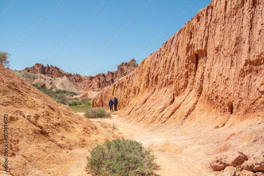 Fototapeta premium Ancient rocks made of red clay against the blue sky