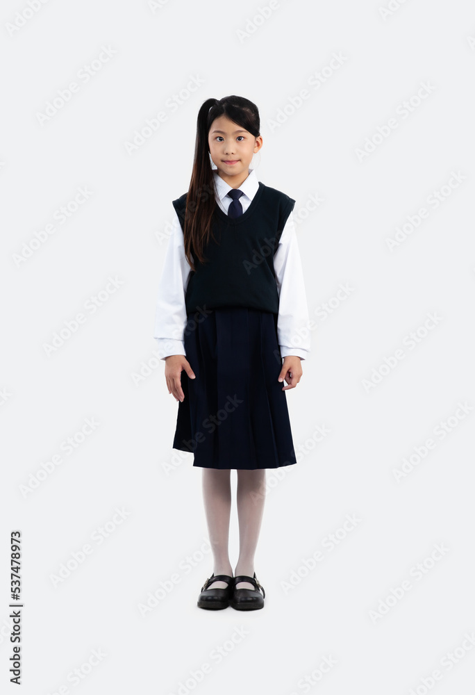 Junior school elementary girl in student uniform standing and looking camera on white background. Junior school elementary girl in student uniform standing and looking camera on white background.