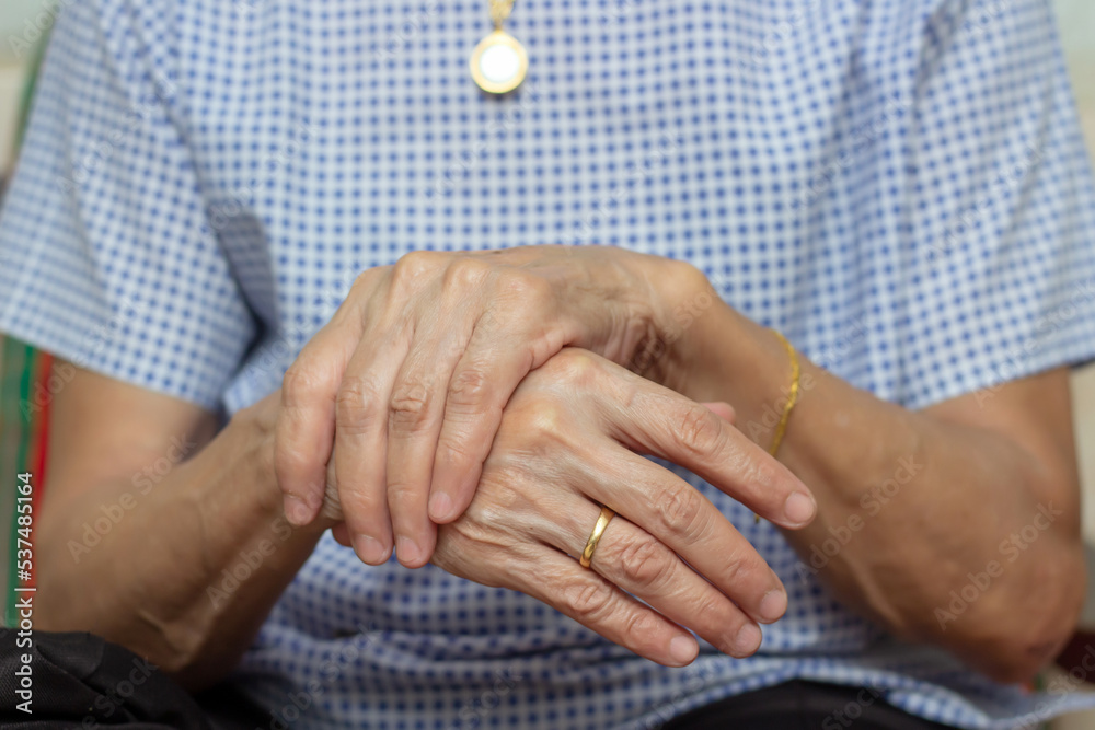 Holding hand adult woman with pain in muscles and joints,Symptoms of