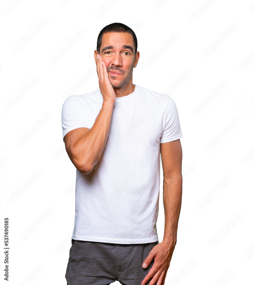 Fototapeta premium Concerned young man doing a gesture of relief