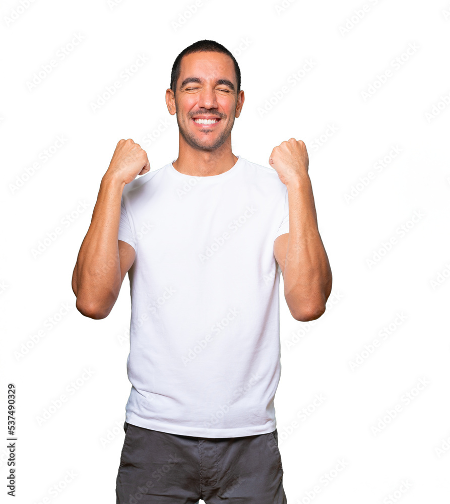 Happy young man doing a competitive gesture Happy young man doing a competitive gesture