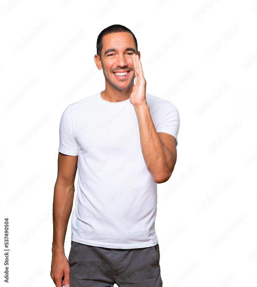 Happy young man trying to say something strongly Happy young man trying to say something strongly