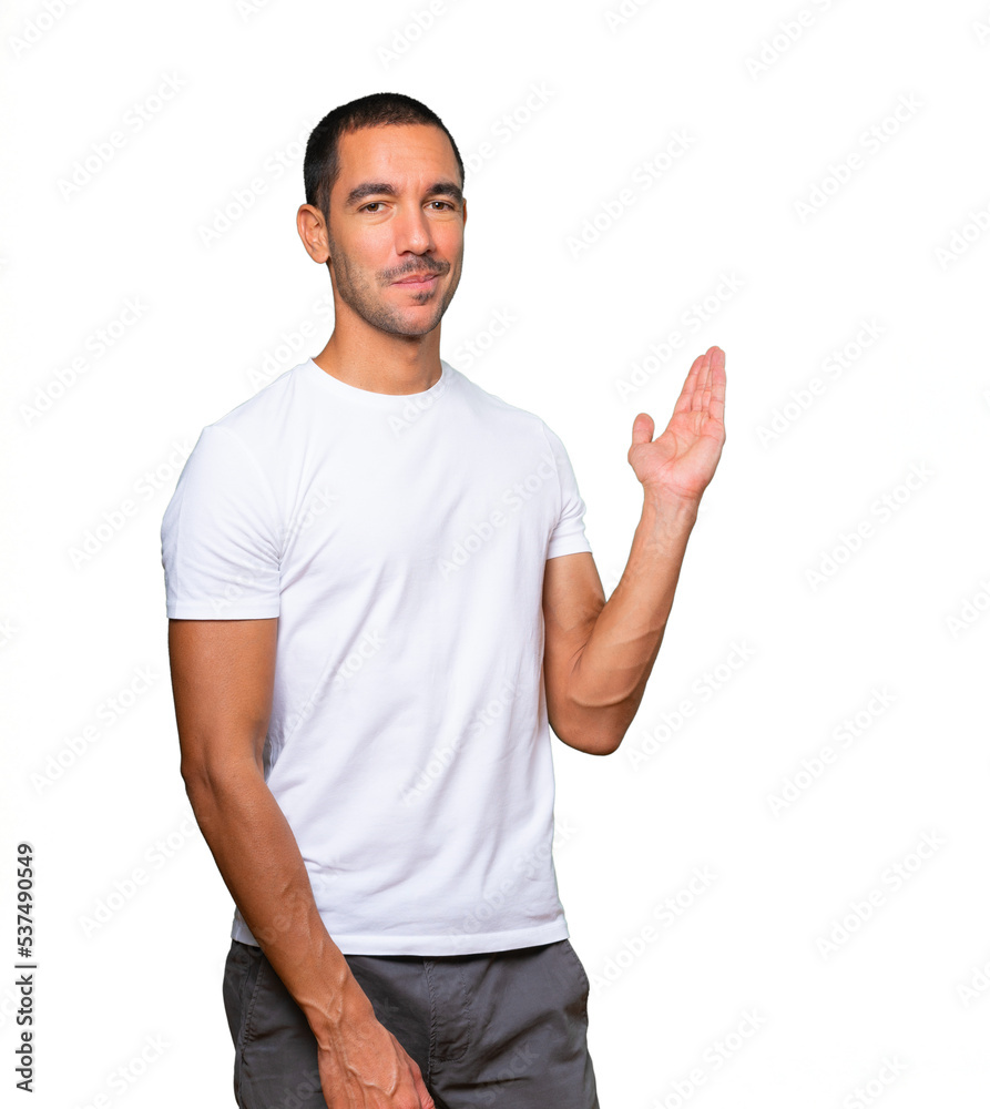 Friendly young man making a gesture of welcome Friendly young man making a gesture of welcome