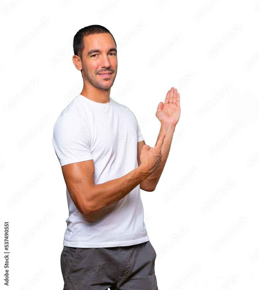 Friendly young man making a gesture of welcome Friendly young man making a gesture of welcome