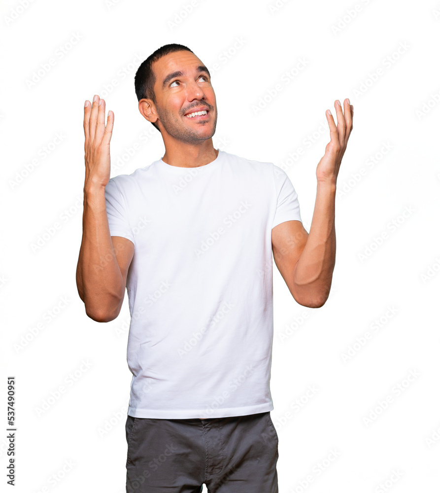 Astonished young man looking up Astonished young man looking up
