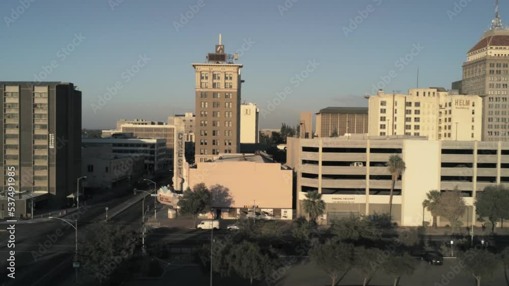 urban cityscape, downtown buildings short pan left during sunset