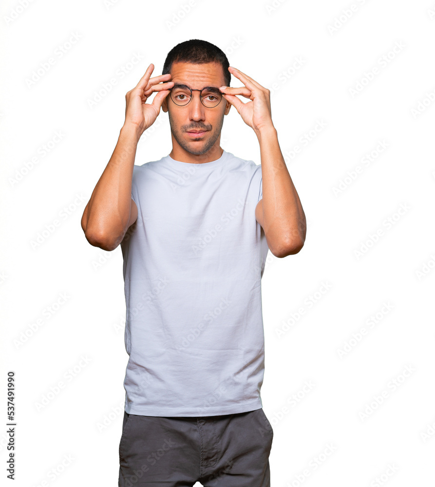 Concerned young man with a stress gesture Concerned young man with a stress gesture