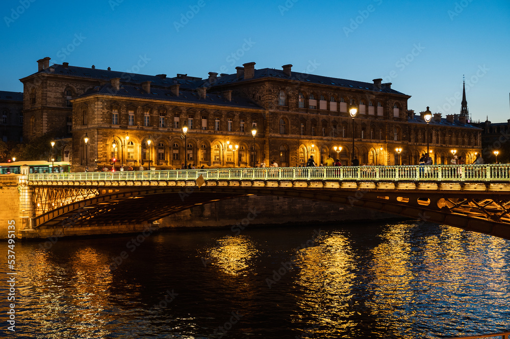 The Hotel-Dieu is a hospital located in the 4th arrondissement of Paris, on the parvis of Notre-Dame, night time lights, view at night from river Seine