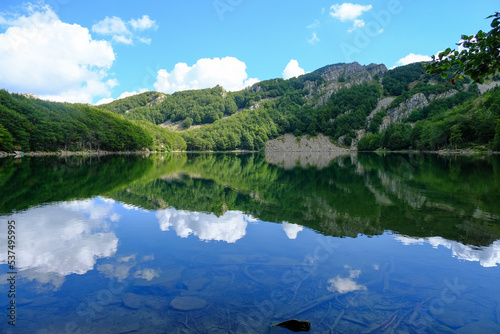 Lake Santo, Lago Santo across the mountains and woods. Nature reflects on the surface of the lake. National park Appennino Tosco-Emiliano. Lagdei, Emilia-Romagna photo