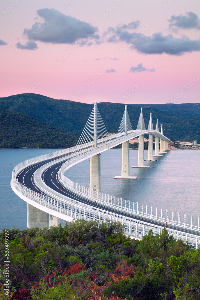 Peljesac Bridge, Croatia. Image of beautiful modern multi-span cable-stayed Peljesac Bridge over the sea in Dubrovnik-Neretva County, Croatia at sunrise.