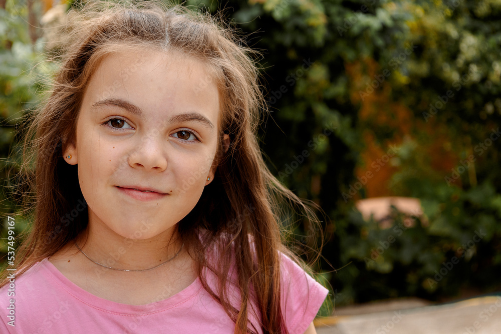 Portrait of cheerful laughing little girl on summer day. High quality photo Portrait of cheerful laughing little girl on summer day. High quality photo