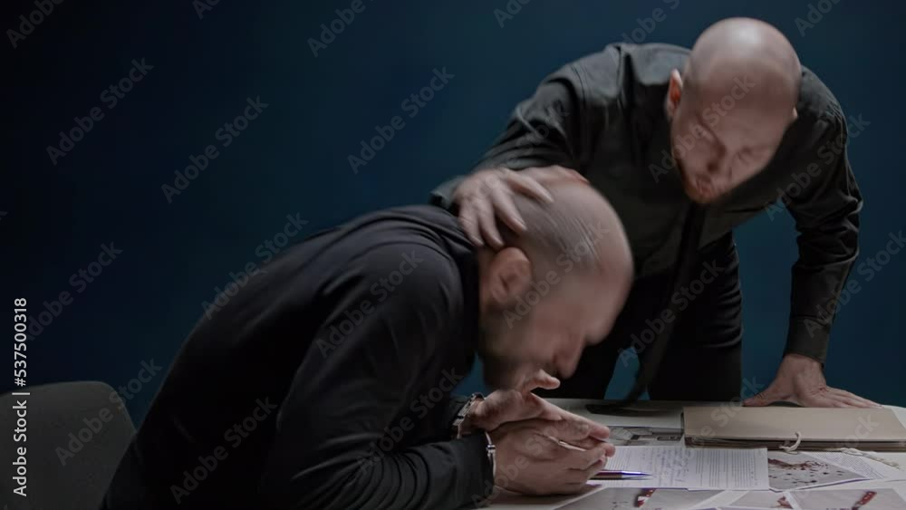 Police detective hits suspected criminal with his head on table. Interrogation without lawyer. Use of physical violence. Abuse of official authority. FBI agent is roughly forced to confess to crime Police detective hits suspected criminal with his head on table. Interrogation without lawyer. Use of physical violence. Abuse of official authority. FBI agent is roughly forced to confess to crime