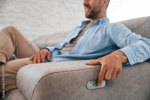 Trying automatic switches. Customer visiting the sofa and bed store. Looking for update