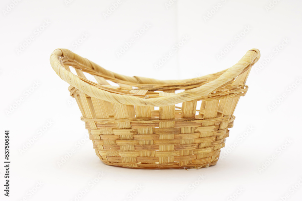 Vintage wicker fruit basket on a white background.