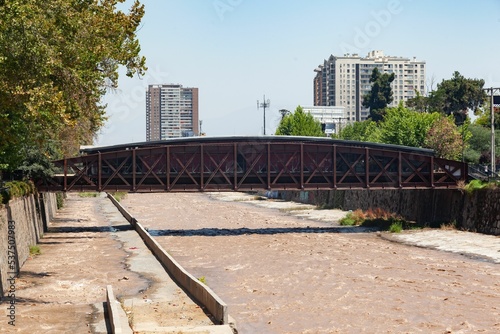 Iron bridge over Mapocho River on a sunny day in Santiago, Chile photo