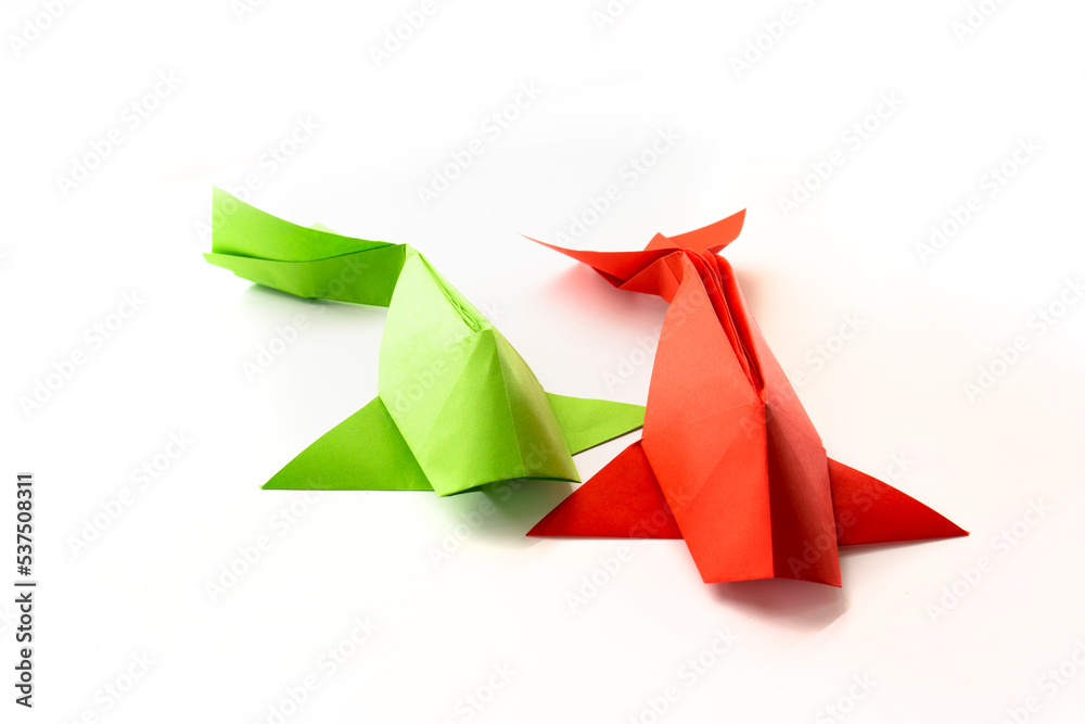 fish from colored paper isolated on white background. origami concept fish from colored paper isolated on white background. origami concept