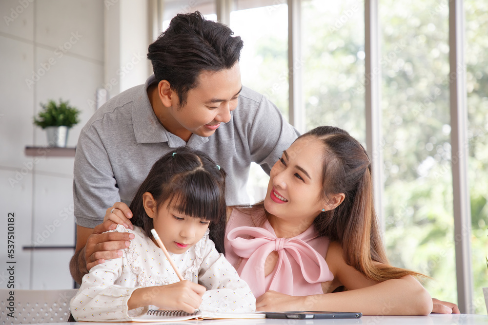Real estate and mortgage concept : Family with child having activity in new home. Joyful first-time buyers in living room. Real estate, residential mortgage, moving into dream house. Real estate and mortgage concept : Family with child having activity in new home. Joyful first-time buyers in living room. Real estate, residential mortgage, moving into dream house.