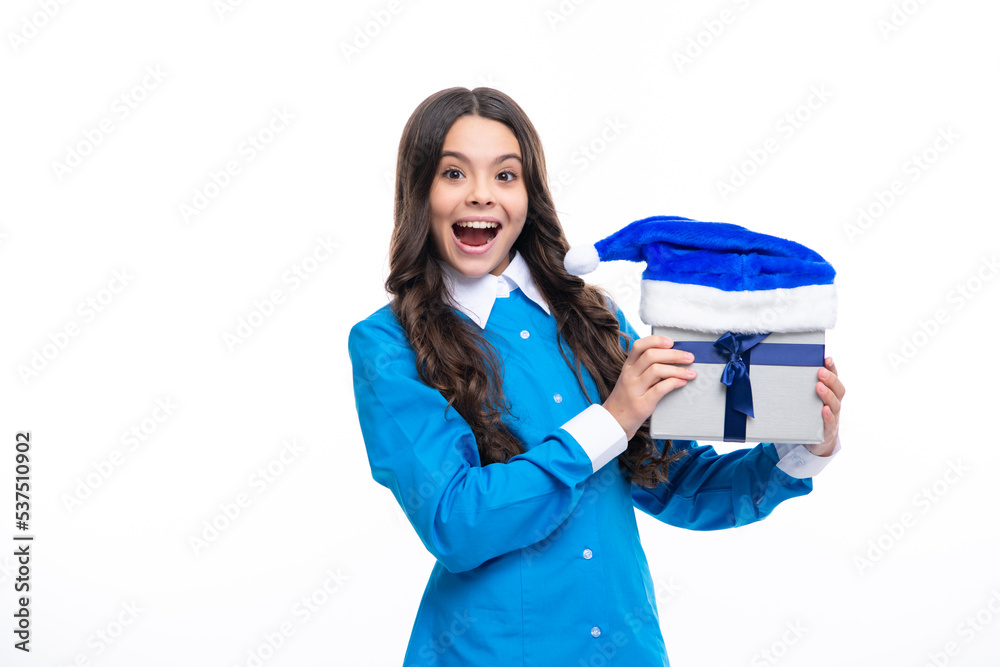 Excited face. Teenager child holding gift box on white isolated background. Gift for kids birthday. Christmas or New Year present box. Amazed expression, cheerful and glad. Excited face. Teenager child holding gift box on white isolated background. Gift for kids birthday. Christmas or New Year present box. Amazed expression, cheerful and glad.
